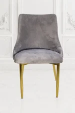 Grey velvet dining chair with polished gold metal legs