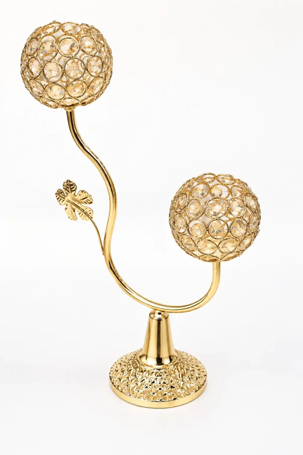 Elegant 2-arm gold crystal candelabra with an S-shaped stem, a decorative leaf, and two textured crystal beaded candle holder globes on a white background