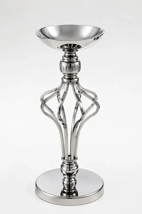 Contemporary silver pillar candle holder featuring a wide top bowl, an open twisted metallic cage stem, and a flat reflective circular base on a white backdrop.