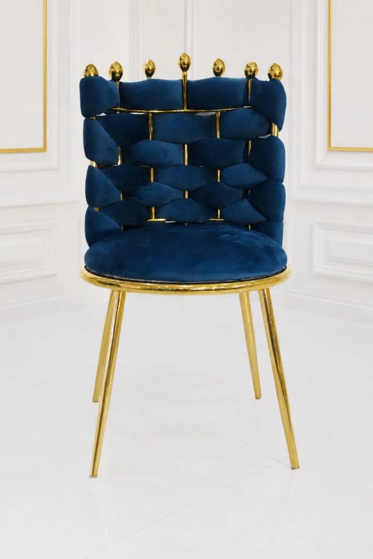 Luxury navy blue velvet dining chair with gold metal legs.