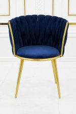 Luxury navy blue velvet dining chair with gold metal legs and scalloped backrest.