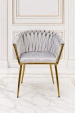 Luxury light grey velvet dining chair with gold metal legs and scalloped shell backrest.