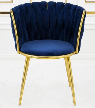 Luxury navy blue velvet dining chair with gold metal legs and scalloped backrest.