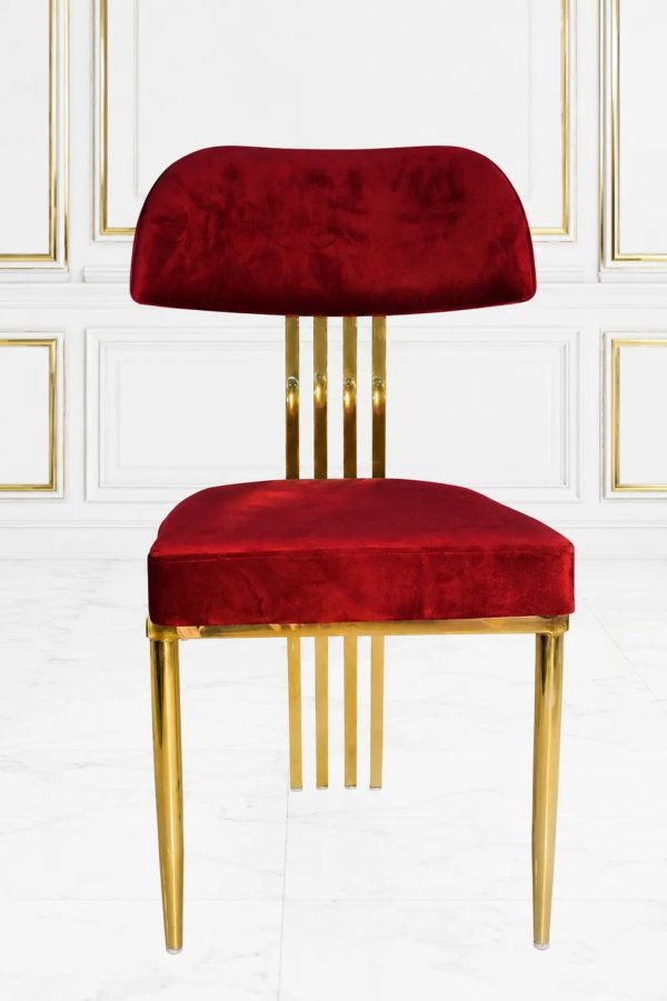 Luxury burgundy velvet dining chair with polished gold metal frame and padded backrest.