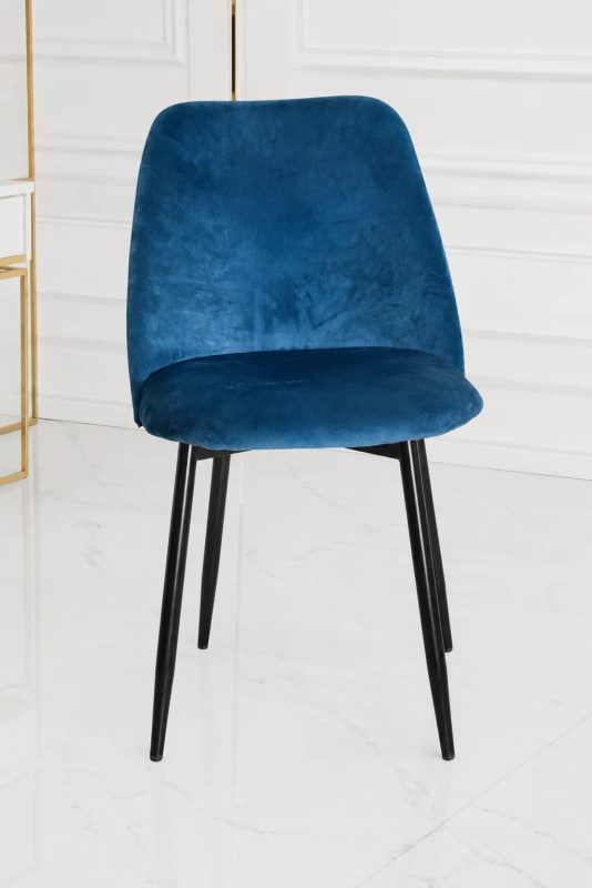 Modern blue velvet dining chair with black metal legs.