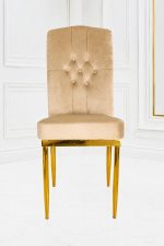 Luxury beige velvet dining chair with button-tufted high back and gold metal legs.