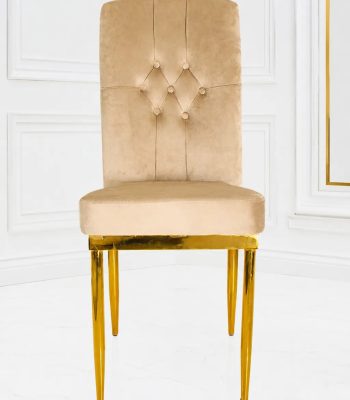 Luxury beige velvet dining chair with button-tufted high back and gold metal legs.