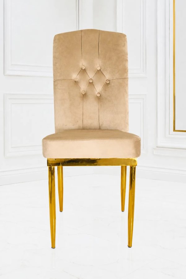 Luxury beige velvet dining chair with button-tufted high back and gold metal legs.