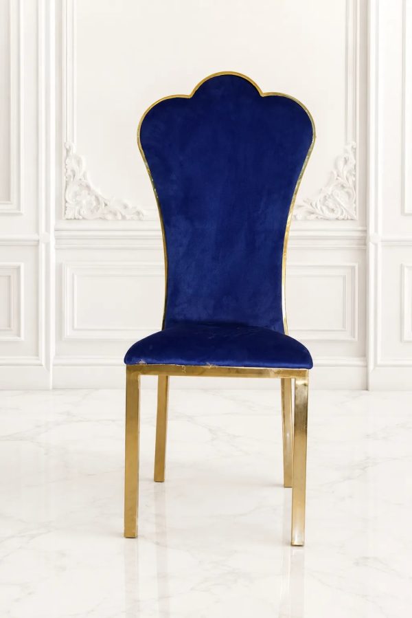 Luxury royal blue velvet dining chair with gold stainless steel frame and crown-shaped high back.