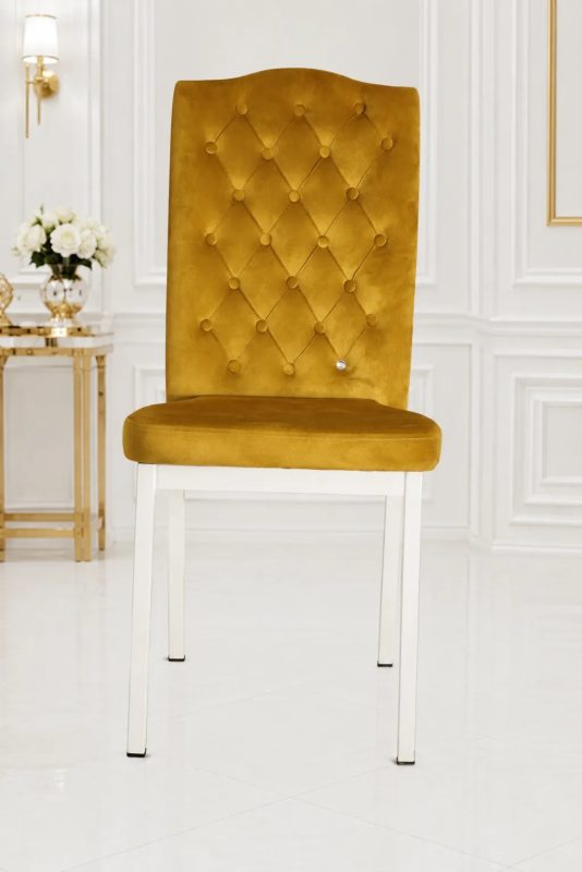 Premium mustard velvet tufted dining chair with white metal legs for modern dining rooms.
