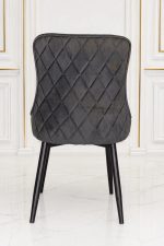 Modern dark grey velvet dining chair with diamond quilted backrest.
