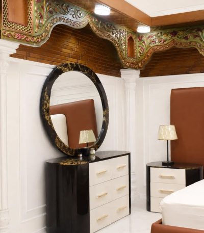 Modern black and white dressing table with round mirror for luxury bedroom.