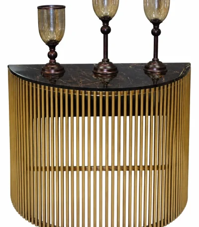 Luxury gold console table with black marble top and three decorative candle holders
