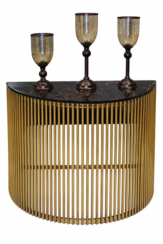 Luxury gold console table with black marble top and three decorative candle holders