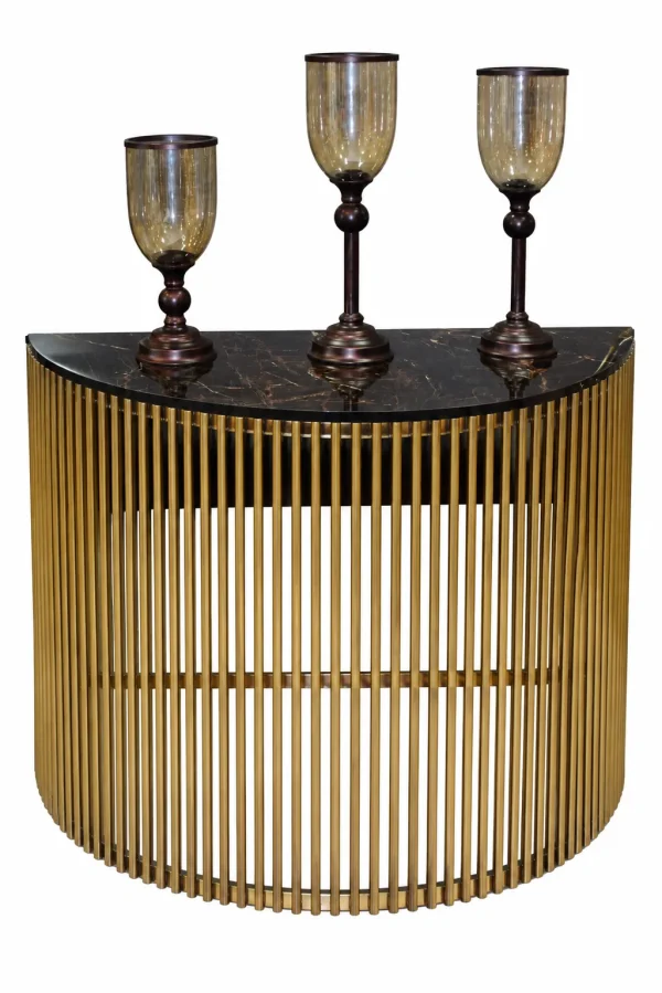 Luxury gold console table with black marble top and three decorative candle holders