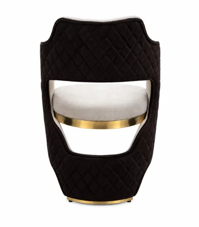 Luxury black quilted accent chair with cream upholstered seat and elegant gold trim